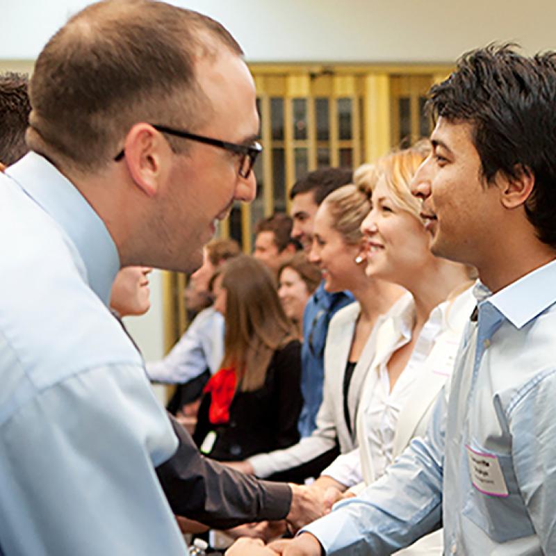People meeting and greeting each other in a room