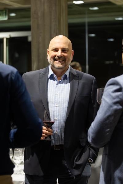 Man holding wine at a event