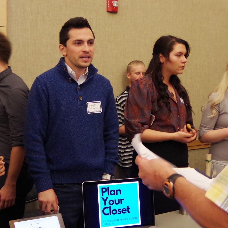 Students Present Their Business Plan to a Business Professor