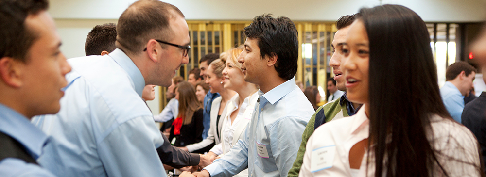 business and economics students at networking event